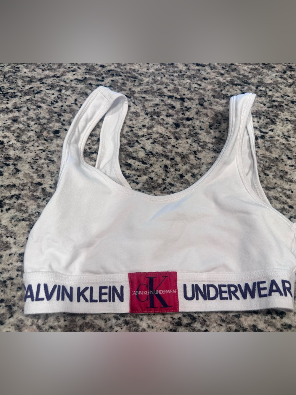 Calvin Klein White Sports Bralette with Navy Logo Band and Red Patch